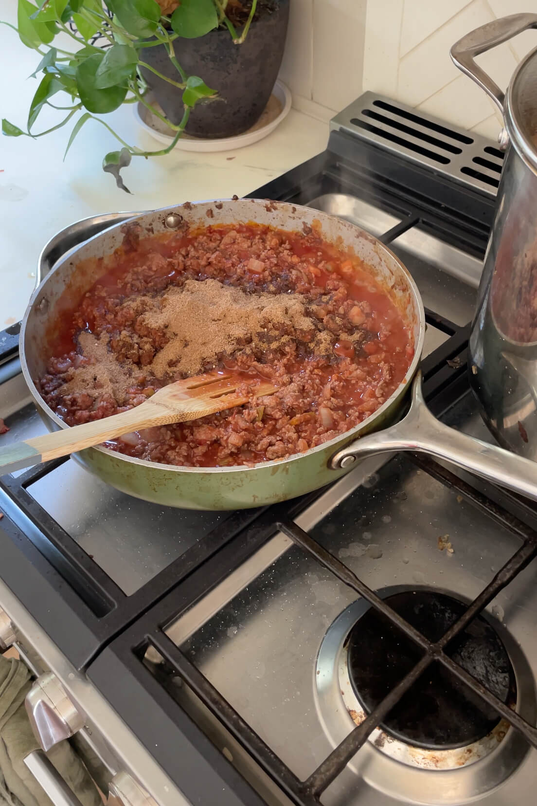 Seasoning a classic blue ribbon chili recipe.